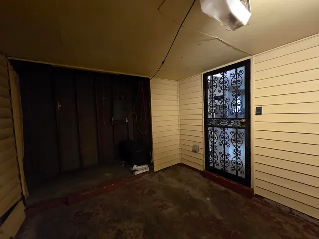 a view of outdoor space with wooden walls