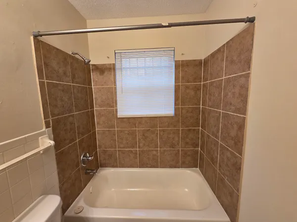 a bathroom with a bath tub