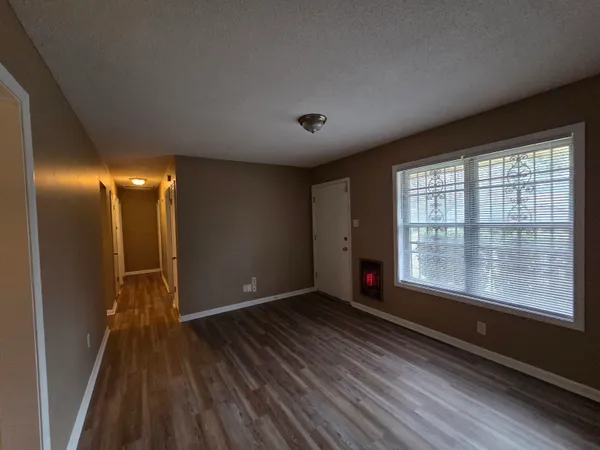 a view of gallery with wooden floor
