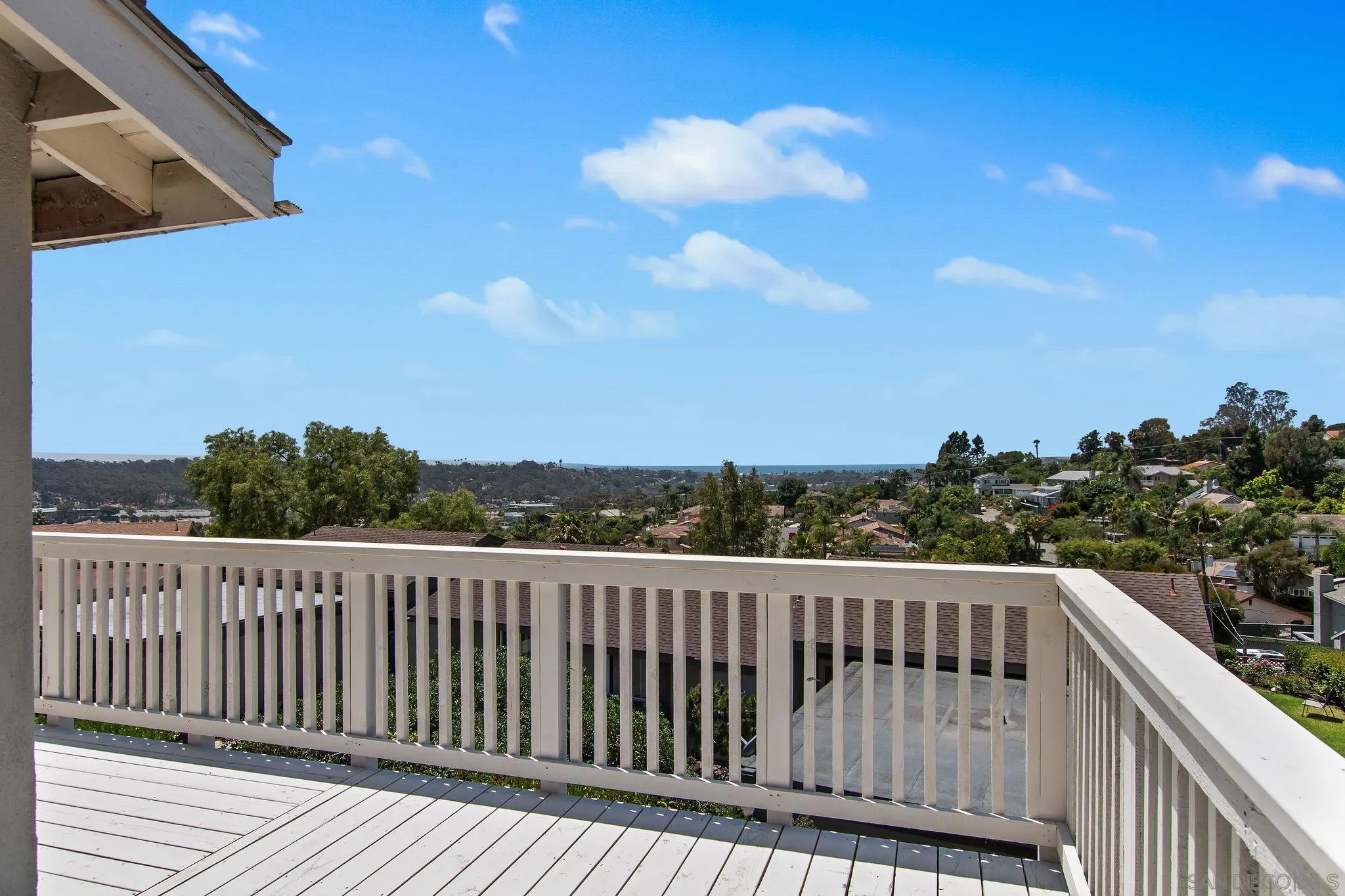 1957 Outrigger Way Oceanside, CA 92054 - Photo 6 of 32 a balcony with wooden floor in city view