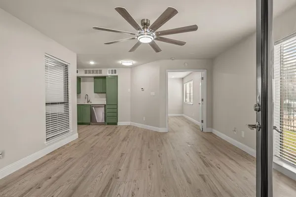 a view of an empty room with a window
