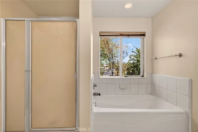 a white bath tub sitting next to a window