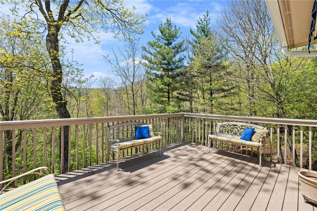 480 North Ridge Circle Boone, NC 28607 - Photo 35 of 50 a balcony with wooden floor and furniture