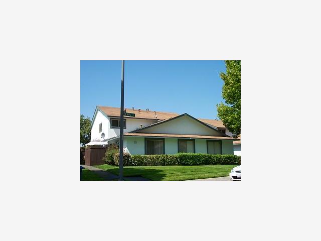 371 Ethyl Street, Unit 2 Milpitas, CA 95035 - Photo 1 of 1 a view of a house with a small yard and plants