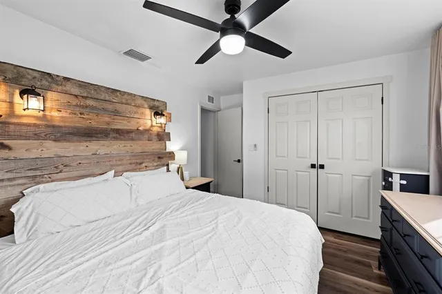 a bedroom with a bed and a walk in closet