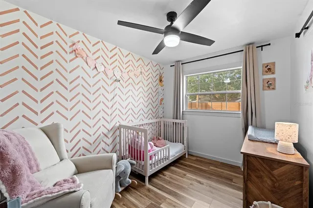 a bed room with a bed and a window