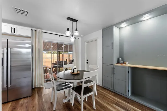 a kitchen with a table and chairs