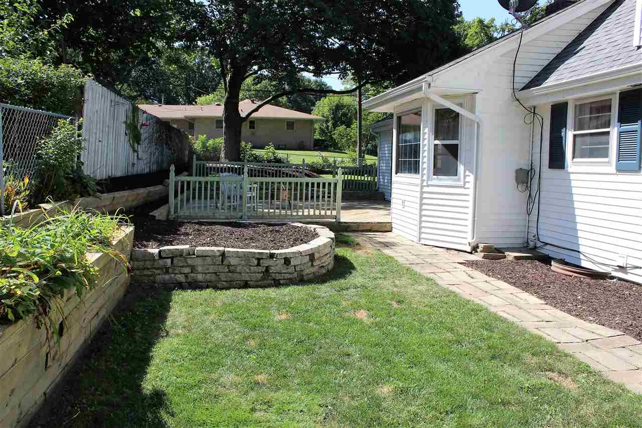 1506 Warren Road Rockford, IL 61108 - Photo 25 of 25 a view of a chair and table in backyard