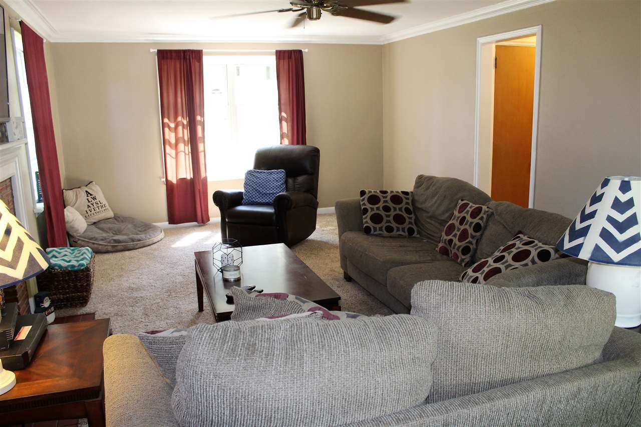 1506 Warren Road Rockford, IL 61108 - Photo 8 of 25 a living room with furniture or couch and a window