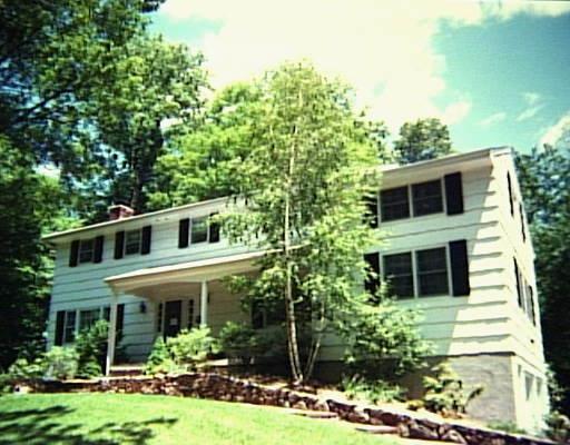 225 Mimosa Circle Ridgefield, CT 06877 - Photo 1 of 1 a front view of a house with garden