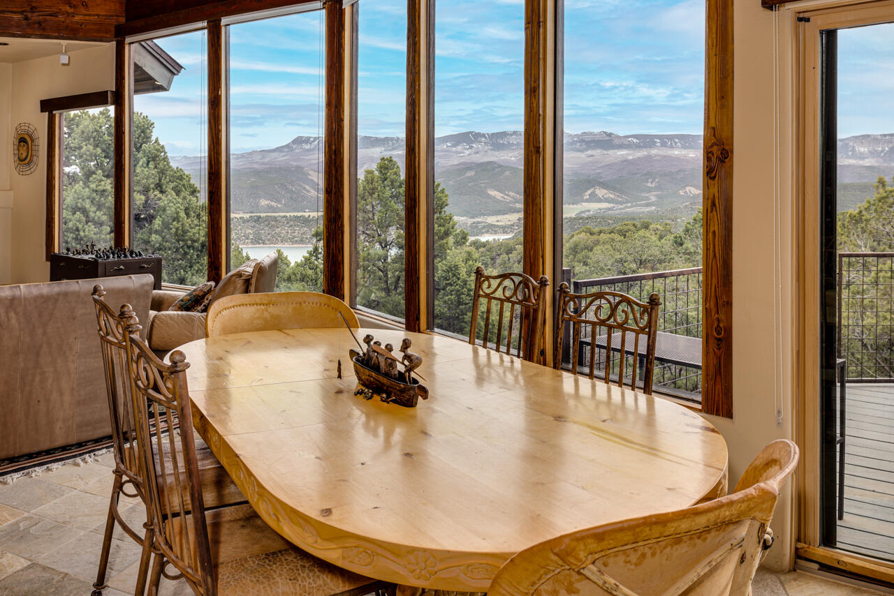499 Waterview Lane Ridgway, CO 81432 - Photo 11 of 43 a dining table sitting next to a window