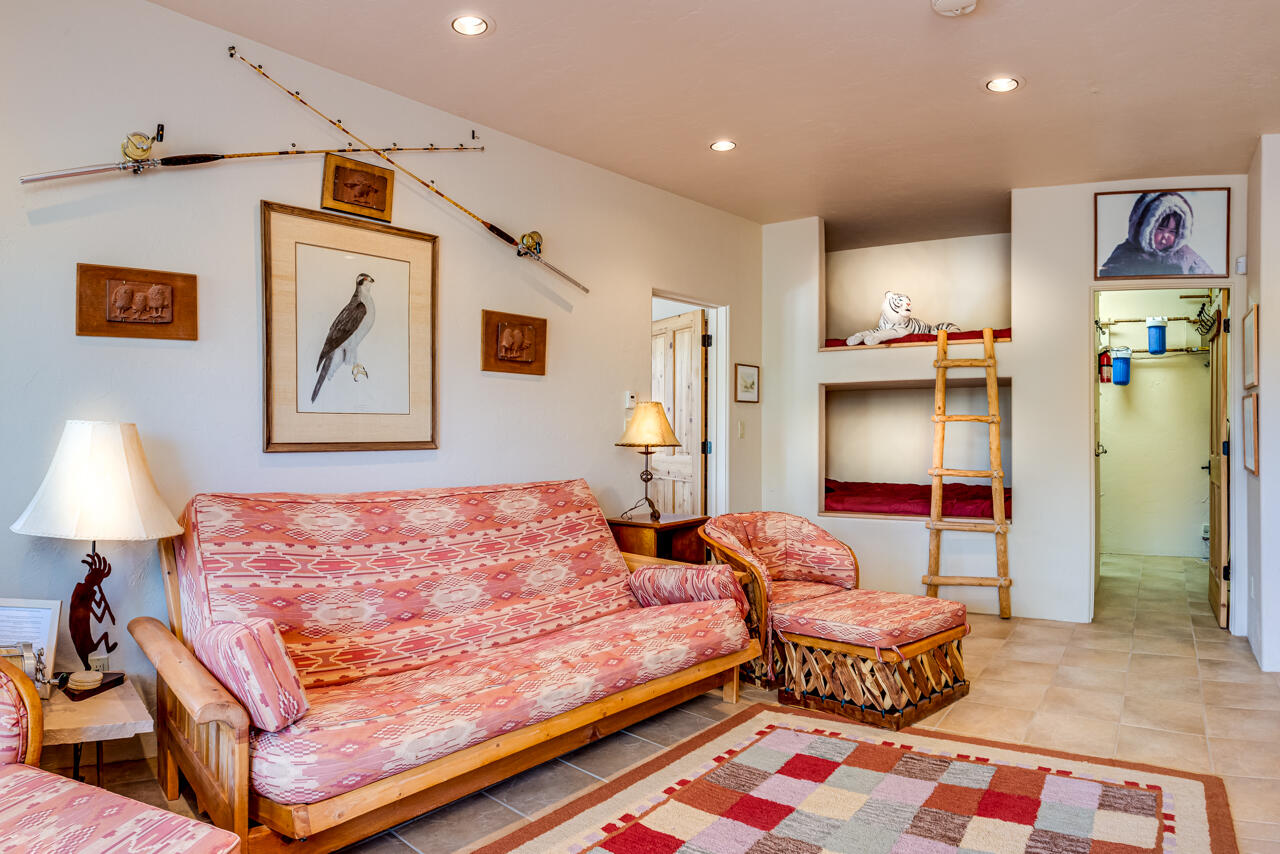 499 Waterview Lane Ridgway, CO 81432 - Photo 18 of 43 a bedroom with furniture and a lamp