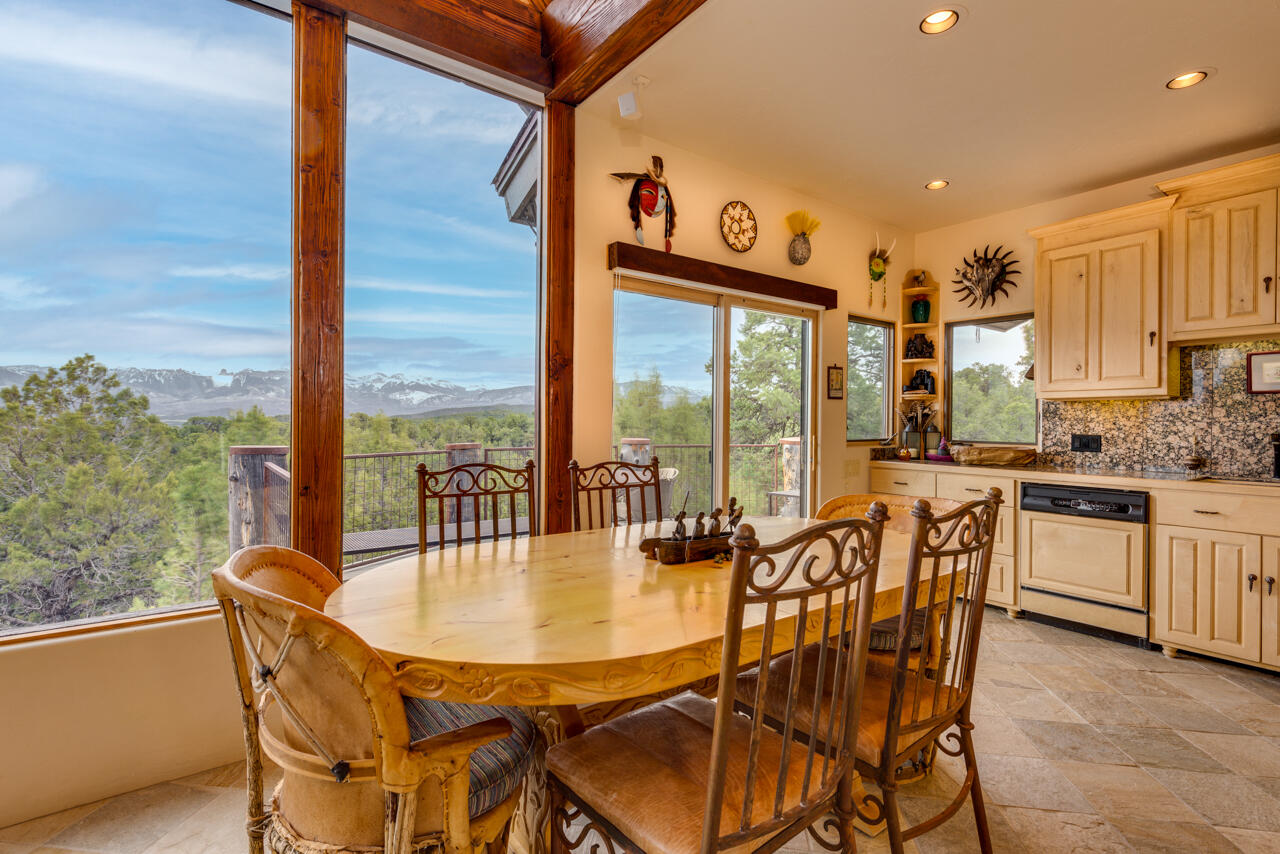 499 Waterview Lane Ridgway, CO 81432 - Photo 10 of 43 a view of a dining room with furniture window and outside view