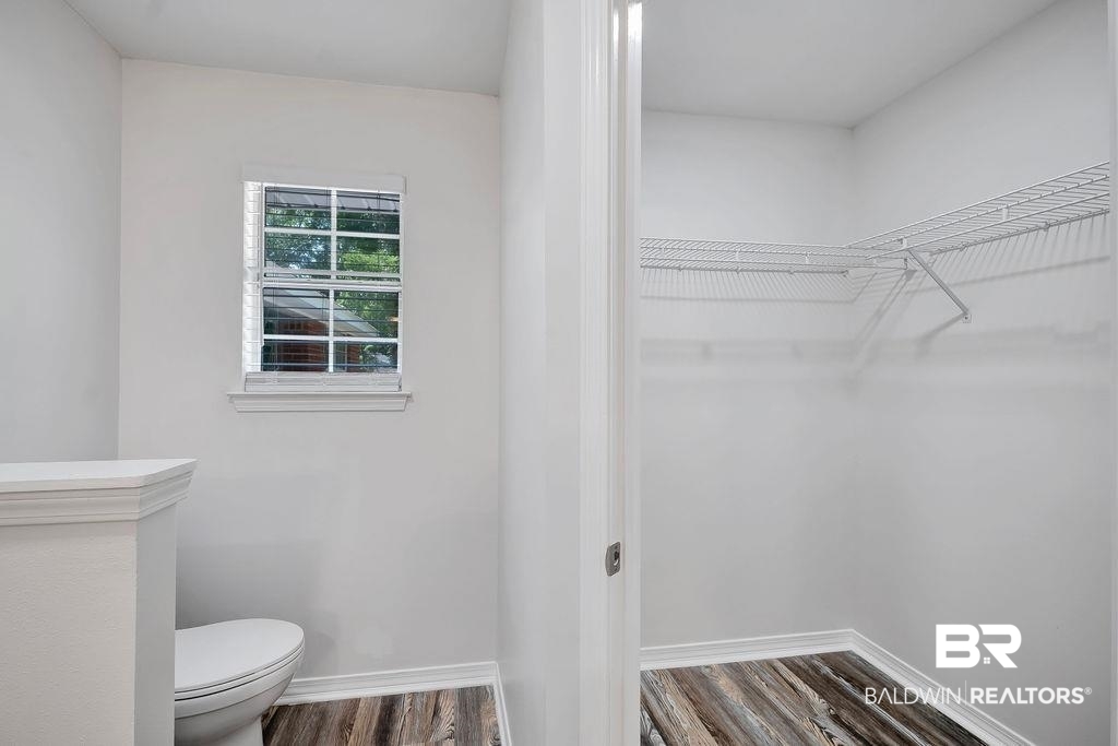 31246 Shambo Road Daphne, AL 36527 - Photo 14 of 26 Bathroom with wood finished floors and a spacious closet