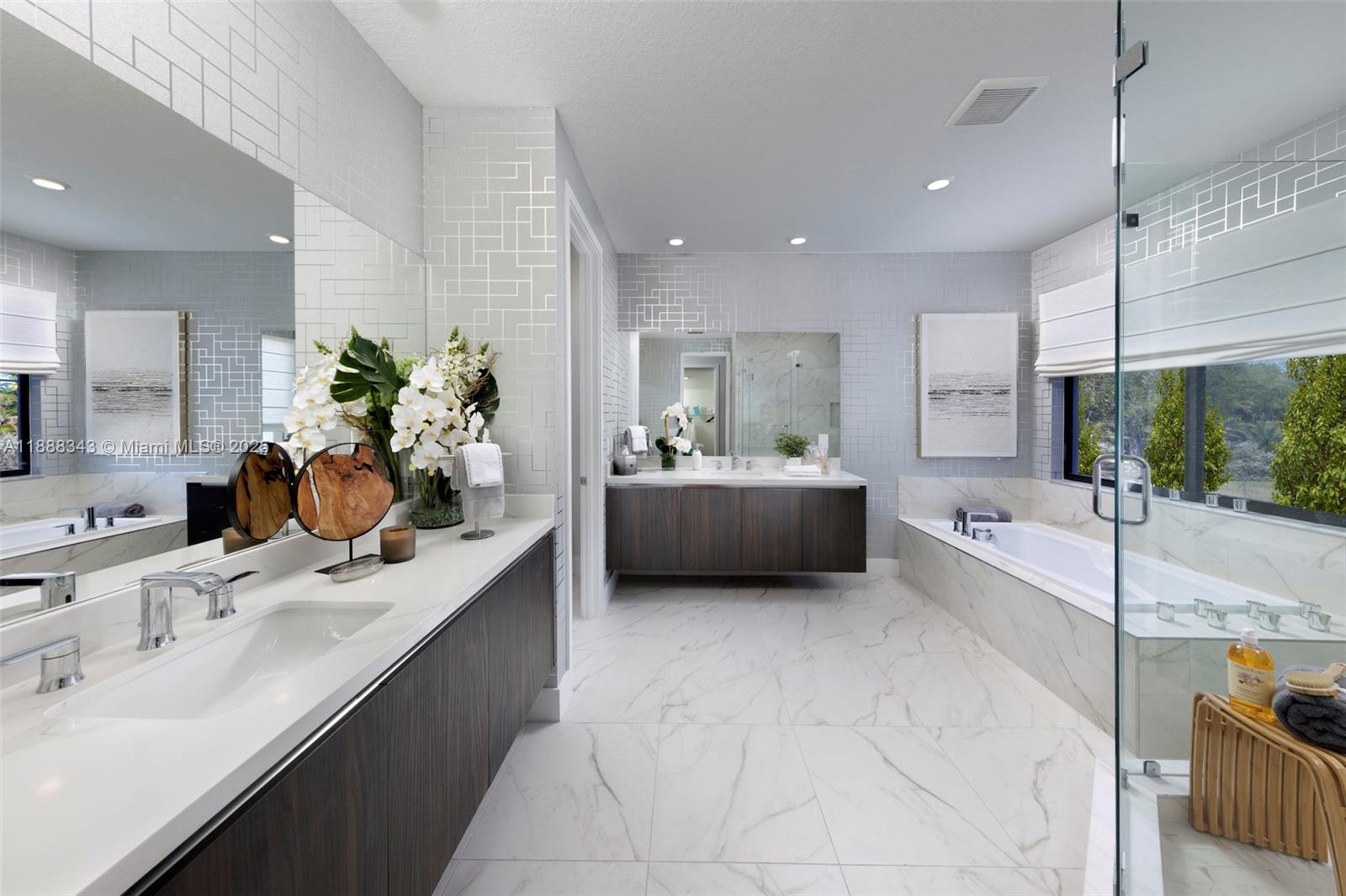 8259 Southwest 120th Terrace Miami, FL 33156 - Photo 13 of 25 a bathroom with a double vanity sink mirror and bathtub