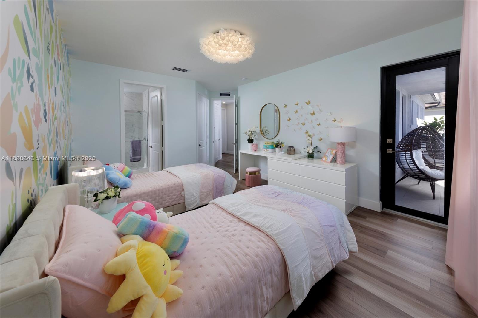 8259 Southwest 120th Terrace Miami, FL 33156 - Photo 18 of 25 a bedroom with two beds and a large mirror with a bookshelf