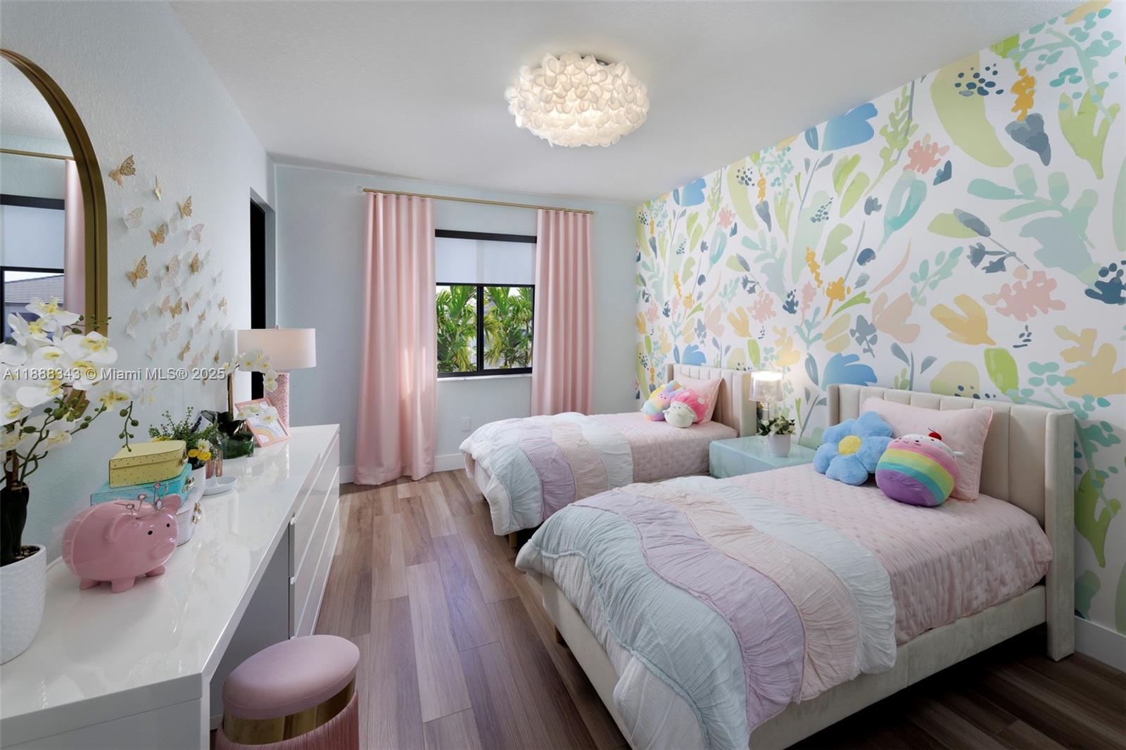 8259 Southwest 120th Terrace Miami, FL 33156 - Photo 20 of 25 a bedroom with two beds and a chandelier