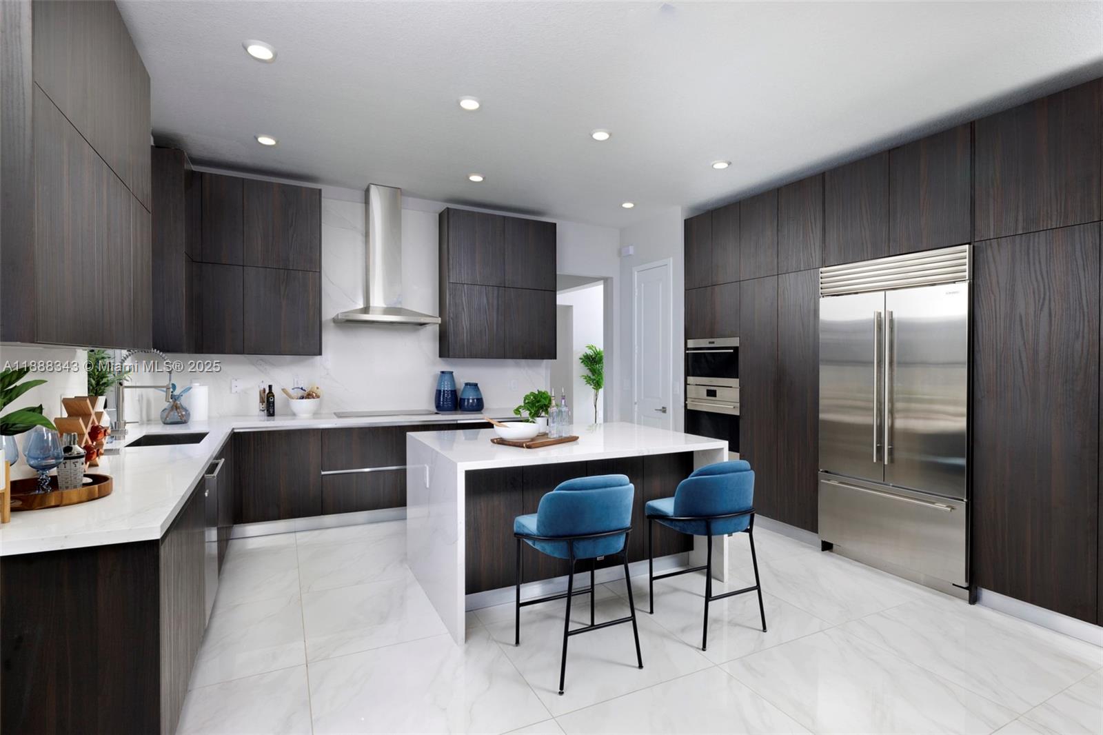 8259 Southwest 120th Terrace Miami, FL 33156 - Photo 2 of 25 a kitchen with a sink stainless steel appliances and cabinets