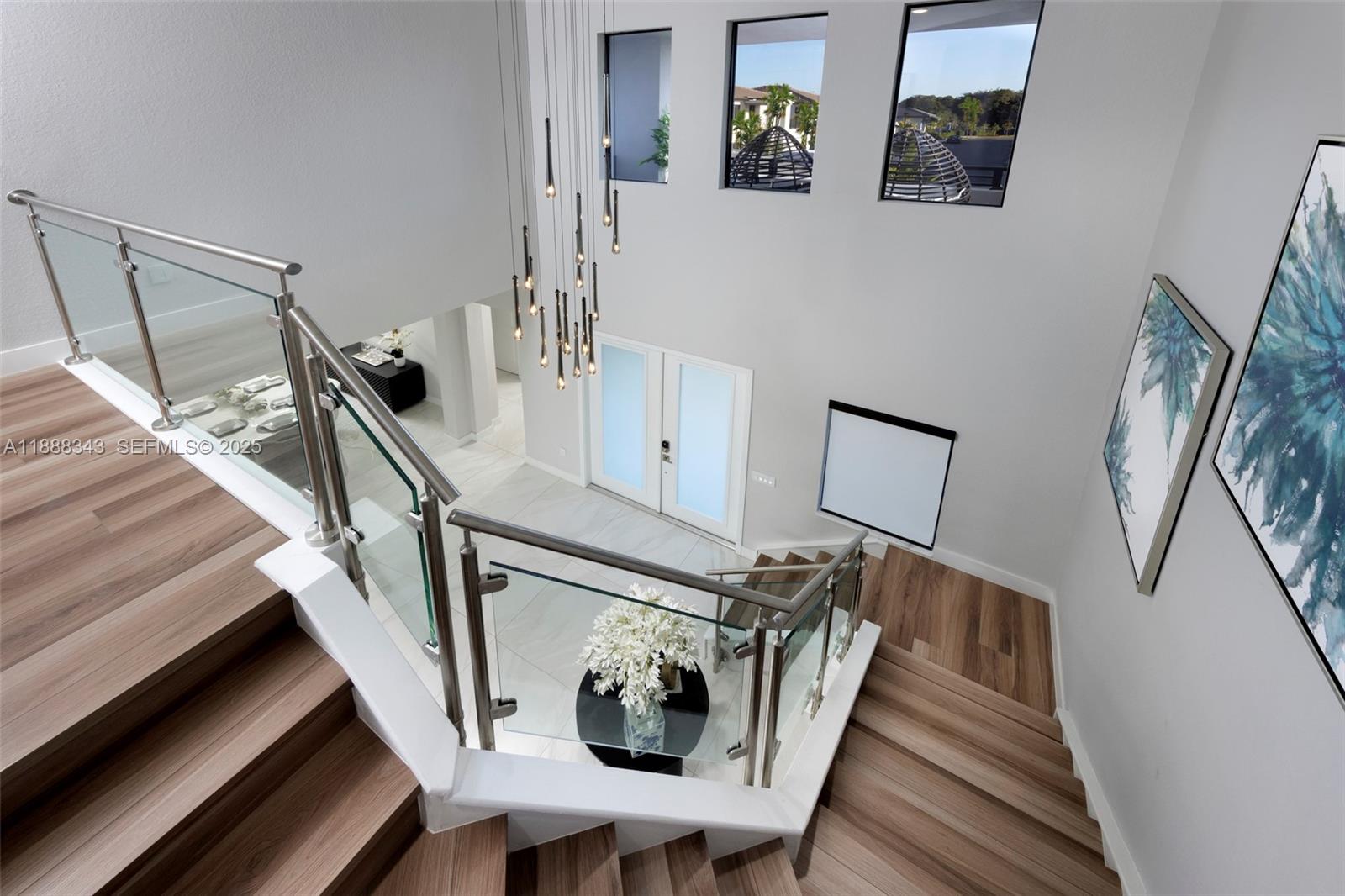 8259 Southwest 120th Terrace Miami, FL 33156 - Photo 6 of 25 a view of an entryway and hall with wooden floor
