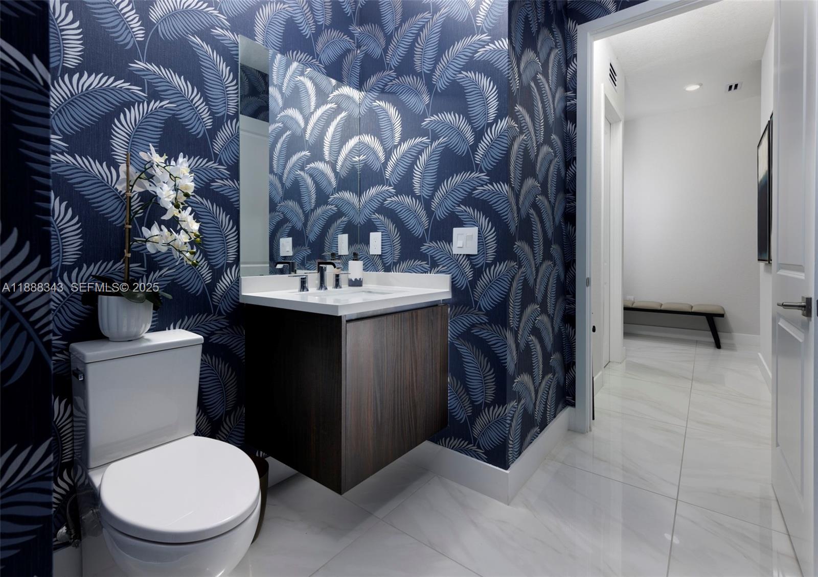 8259 Southwest 120th Terrace Miami, FL 33156 - Photo 9 of 25 a bathroom with a toilet sink and mirror