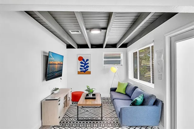 a bathroom with a sink mirror and shower