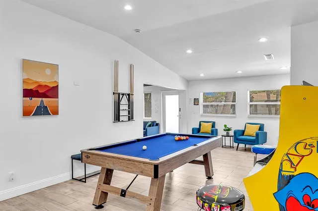 a kitchen with a sink a microwave and cabinets