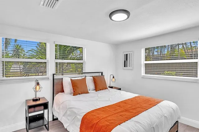 a kitchen with stainless steel appliances a refrigerator sink and cabinets