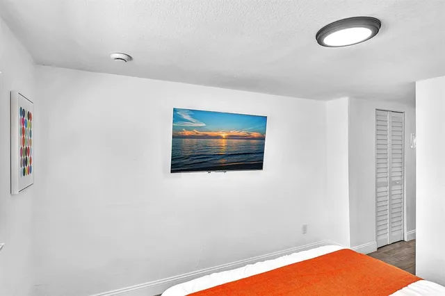 a bedroom with a bed and a view of bedroom