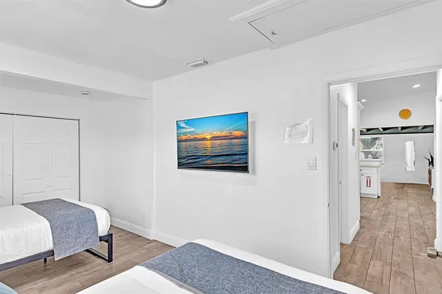 a view of a patio with a table and chairs under an umbrella