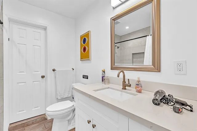 a view of a house with a swimming pool and sitting area