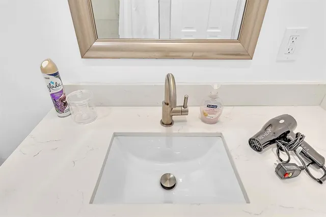 a potted plant sitting on the side of a window