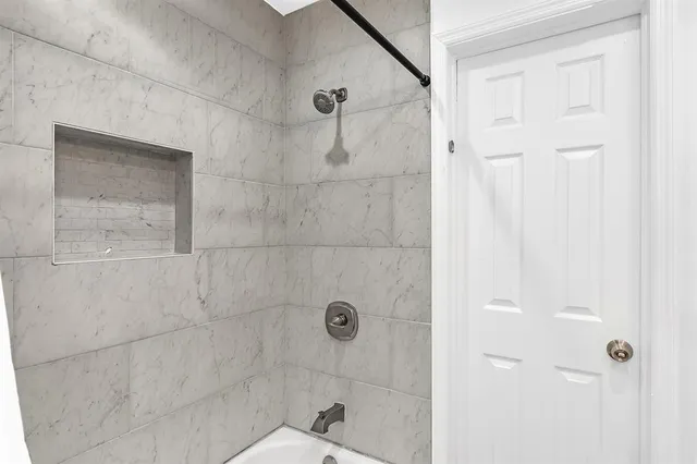 an aerial view of residential houses with outdoor space and street view