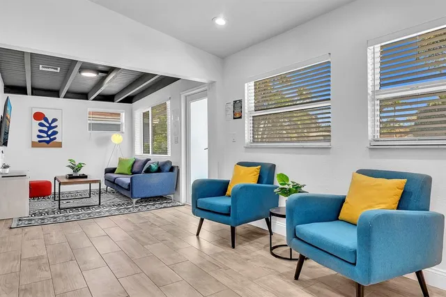 a room with furniture and a flat screen tv