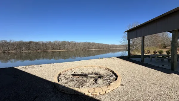 a swimming pool with lake view