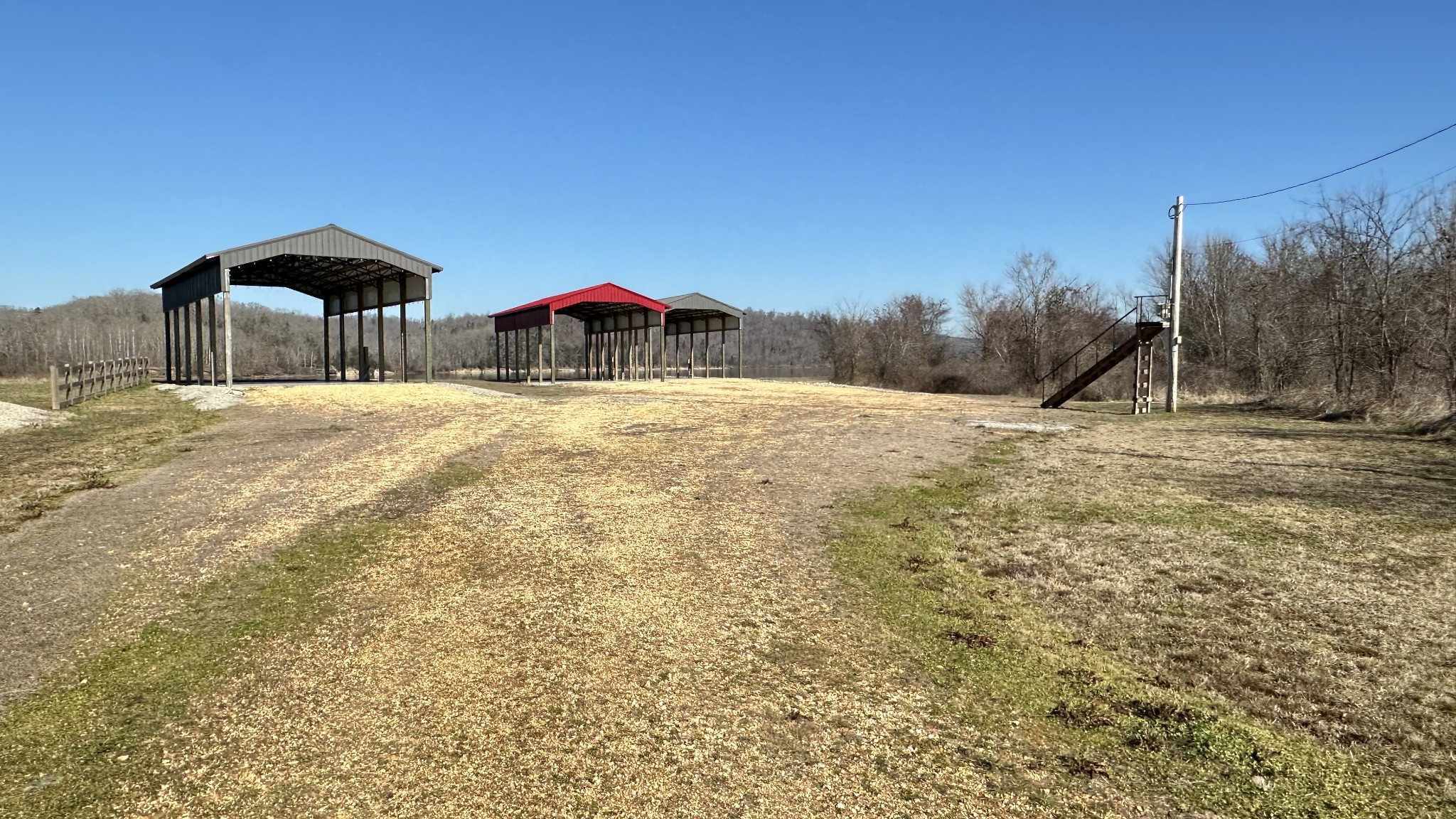 2287 Hardin Bottom River Road Clifton, TN 38425 - Photo 4 of 32 a view of a dirt road with a building in the background
