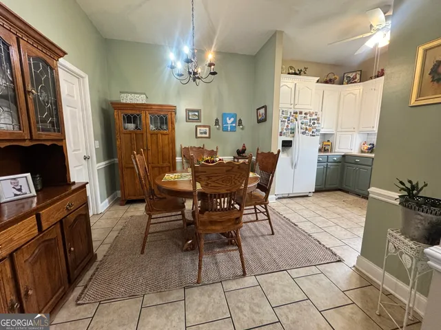 a dining room with furniture and window