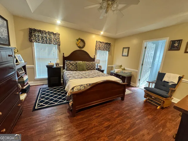 a bedroom with a bed and a chair