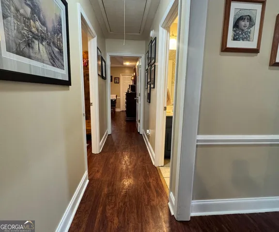 a view of hallway with wooden floor