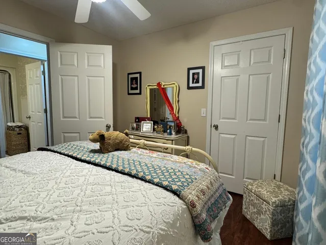 a bedroom with a bed and a closet