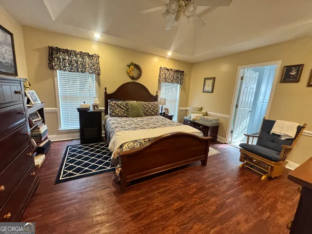 a bedroom with a bed and a chair