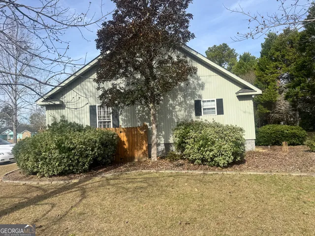 a view of outdoor space with deck and trees