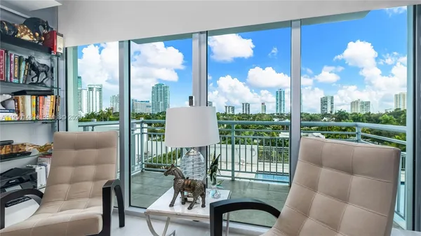 a room with furniture and a flat screen tv