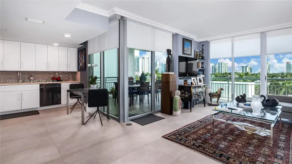 a kitchen with a refrigerator sink and cabinets