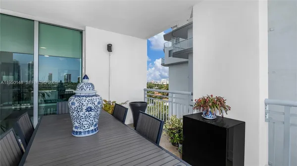 a kitchen with a refrigerator and a sink