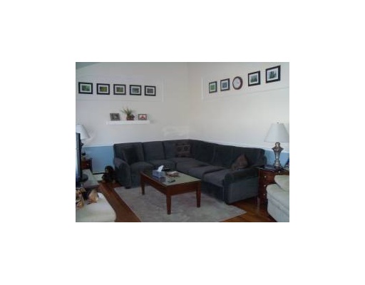 66 Glenbrook Road Warwick, RI 02889 - Photo 5 of 18 Living Room. Spacious & bright living room has hardwoods & cathedral ceiling