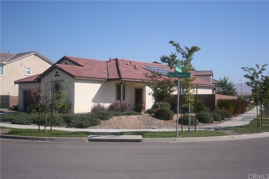 1072 Peach Grove Riverside, CA 92501 - Photo 1 of 1 a front view of a house with a yard and outdoor seating