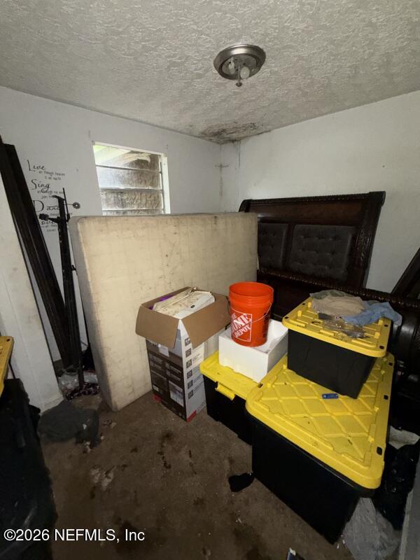 1926 Spring Drive Road Jacksonville, FL 32209 - Photo 19 of 19 a blue bed sitting in a room next to a window