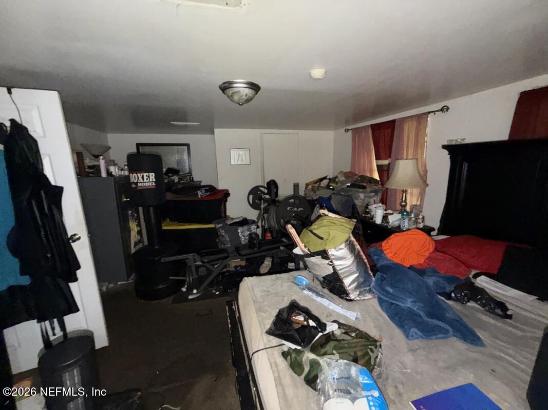 1926 Spring Drive Road Jacksonville, FL 32209 - Photo 2 of 19 a room with furniture and gym equipment