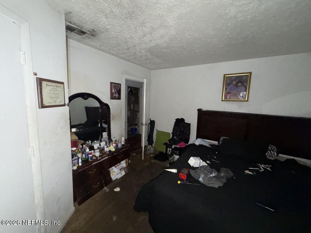 1926 Spring Drive Road Jacksonville, FL 32209 - Photo 10 of 19 a living room with furniture a rug and a flat screen tv