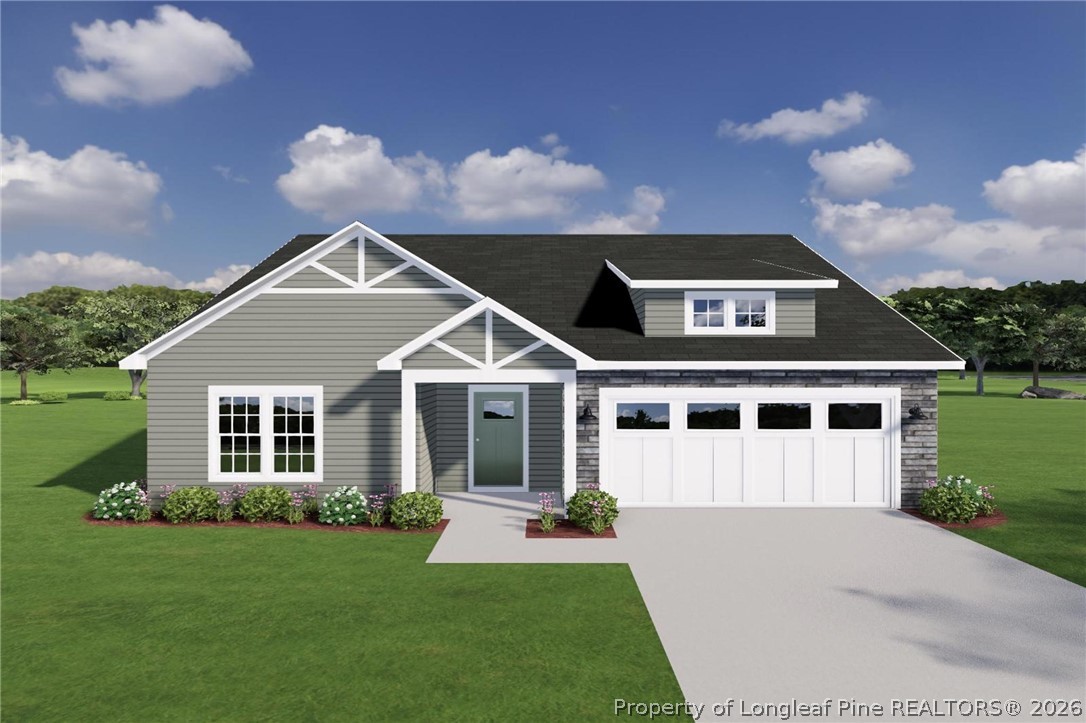 257 Bourbon Street Raeford, NC 28376 - Photo 1 of 1 a front view of a house with a yard and garage